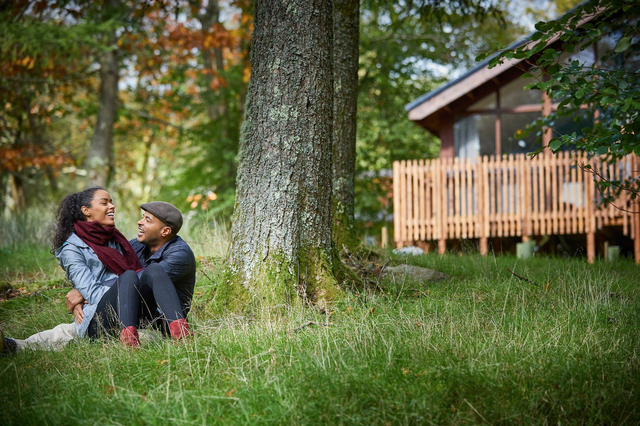 Couple on their mini moon outside of cabin