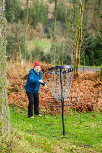 Guest taking part in Disc Golf activity