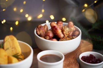 Bowl of pigs in blankets with stuffing balls