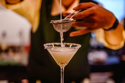 A person making a cocktail