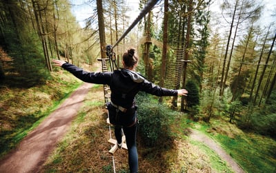 Woman taking part in Go Ape Tree Top Challenge