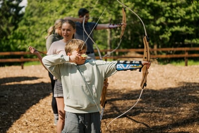 A child taking part in archery