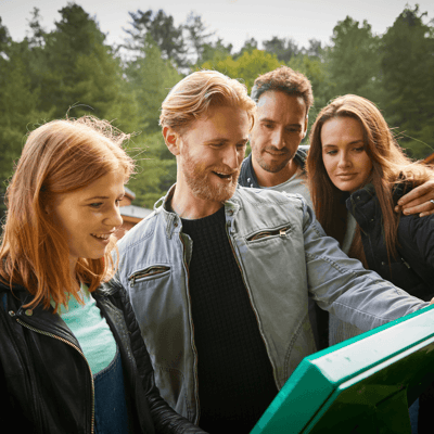 Group reading a walking guide on their hiking holiday