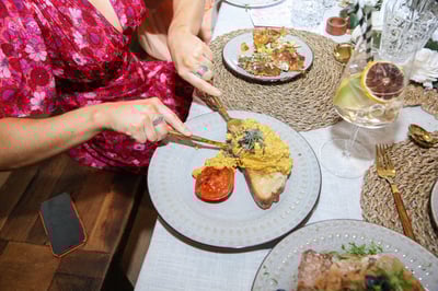 A woman cutting her dinner