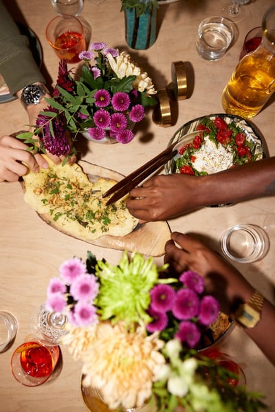 Flatlay image of flowers and dinner plates