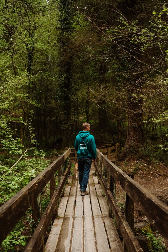 Man and dog walking at Deerpark, Forest Holidays