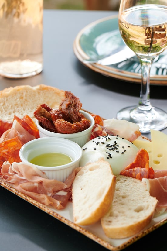 Tapas plate with a glass of rose