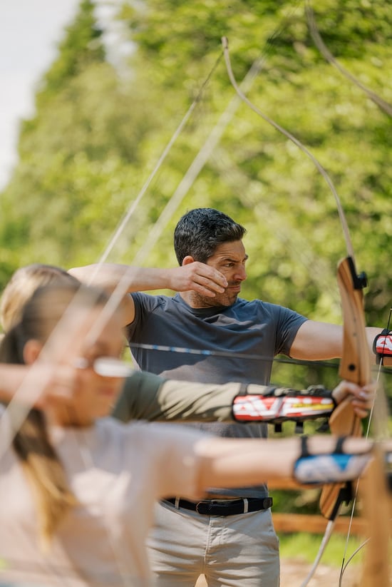 Man using a bow and arrow