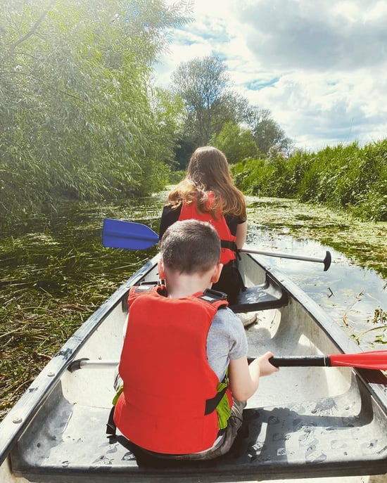 Children canoeing along the River Thet