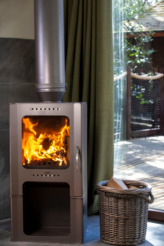 Golden Oak Treehouse log burner at Delamere Forest, Cheshire