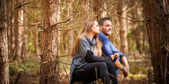A couple in the forest during a Forest Bathing session at Forest Holidays