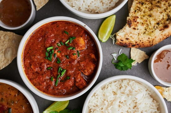 Flatlay of curry, rice and naan bread