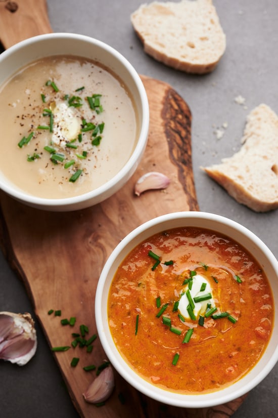 Aerial view of two soups in bowls with bread