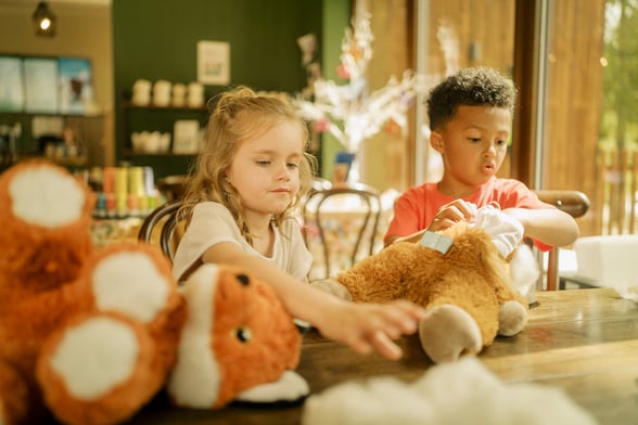 Children making cuddly toys