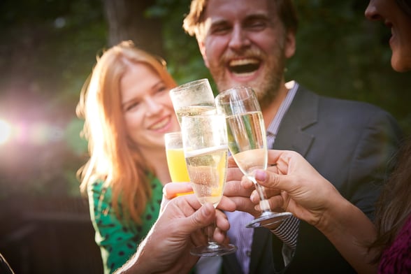 Group clinking their glasses of champagne