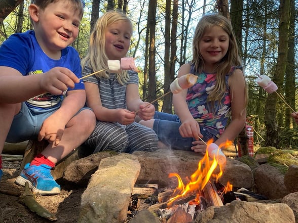 Children toasting marshmallows on Mini Forest Rangers activity