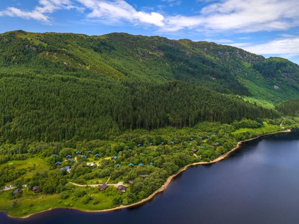 Aerial view of log cabins at Strathyre, Forest Holidays
