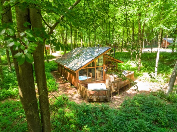 Exterior view of hot tub cabin at Blackwood Forest, Forest Holidays