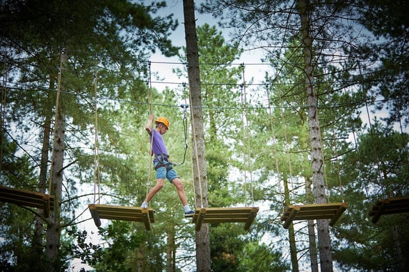Boy on the Treetop adventure at Thorpe Forest, Forest Holidays