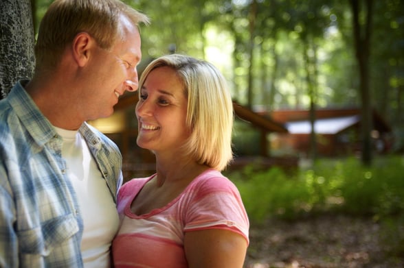 Couple spending a babymoon at Forest Holidays