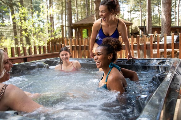 Female friends on a hot tub holiday at Forest Holidays