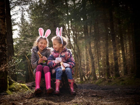 Two girls with Easter bunny ears in the forest