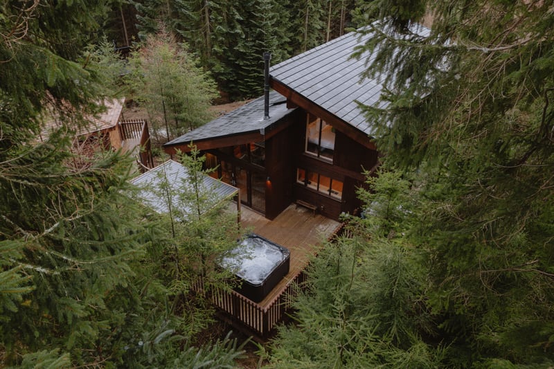 Birds eye view of a log cabin with hot tub at Glentress Forest, Forest Holidays