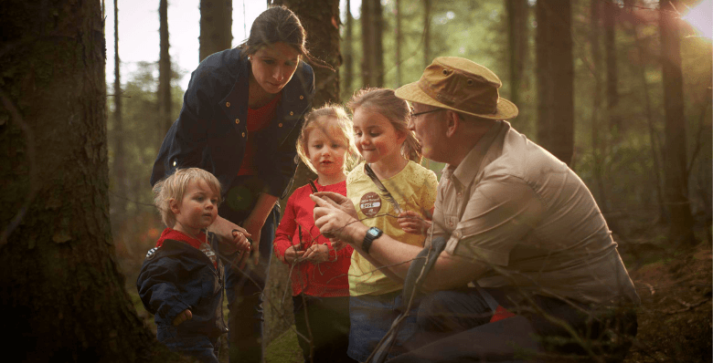 Forest Ranger with guests at Forest Holidays