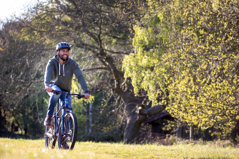 Man cycling through the forest