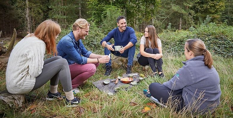 Group sat on the Forest floor with our Forest Ranger