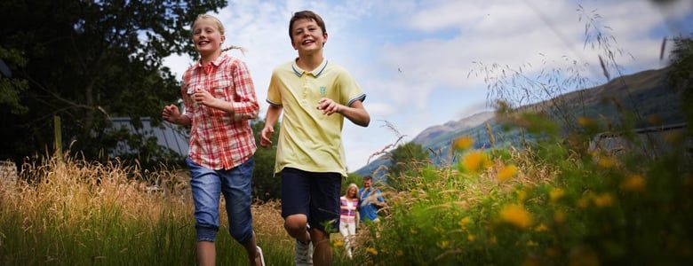 Family walking through the forest