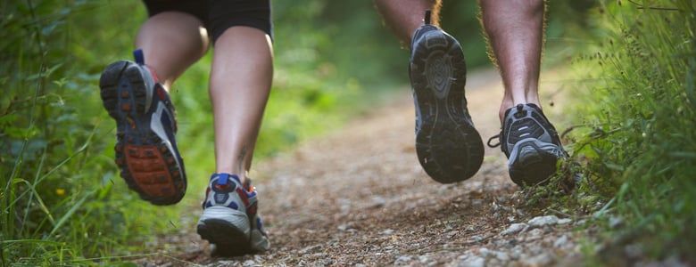 People running through the forest