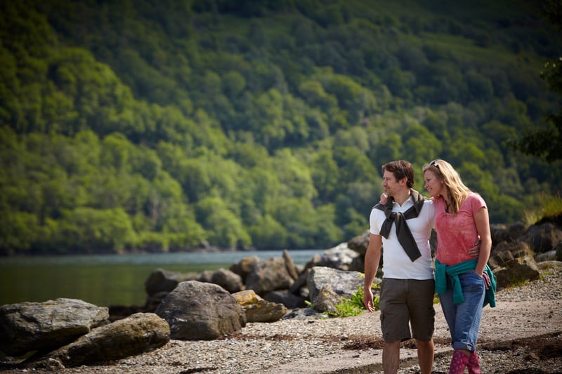 Couple walking at Ardgartan Argyll, Forest Holidays