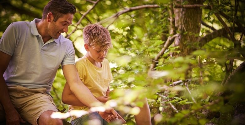 Father and son in the forest