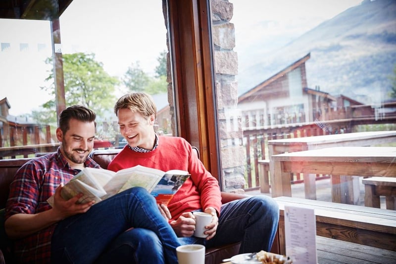 A couple relaxing in the Forest Retreat at Ardgartan argyll, Scotland, Forest Holidays